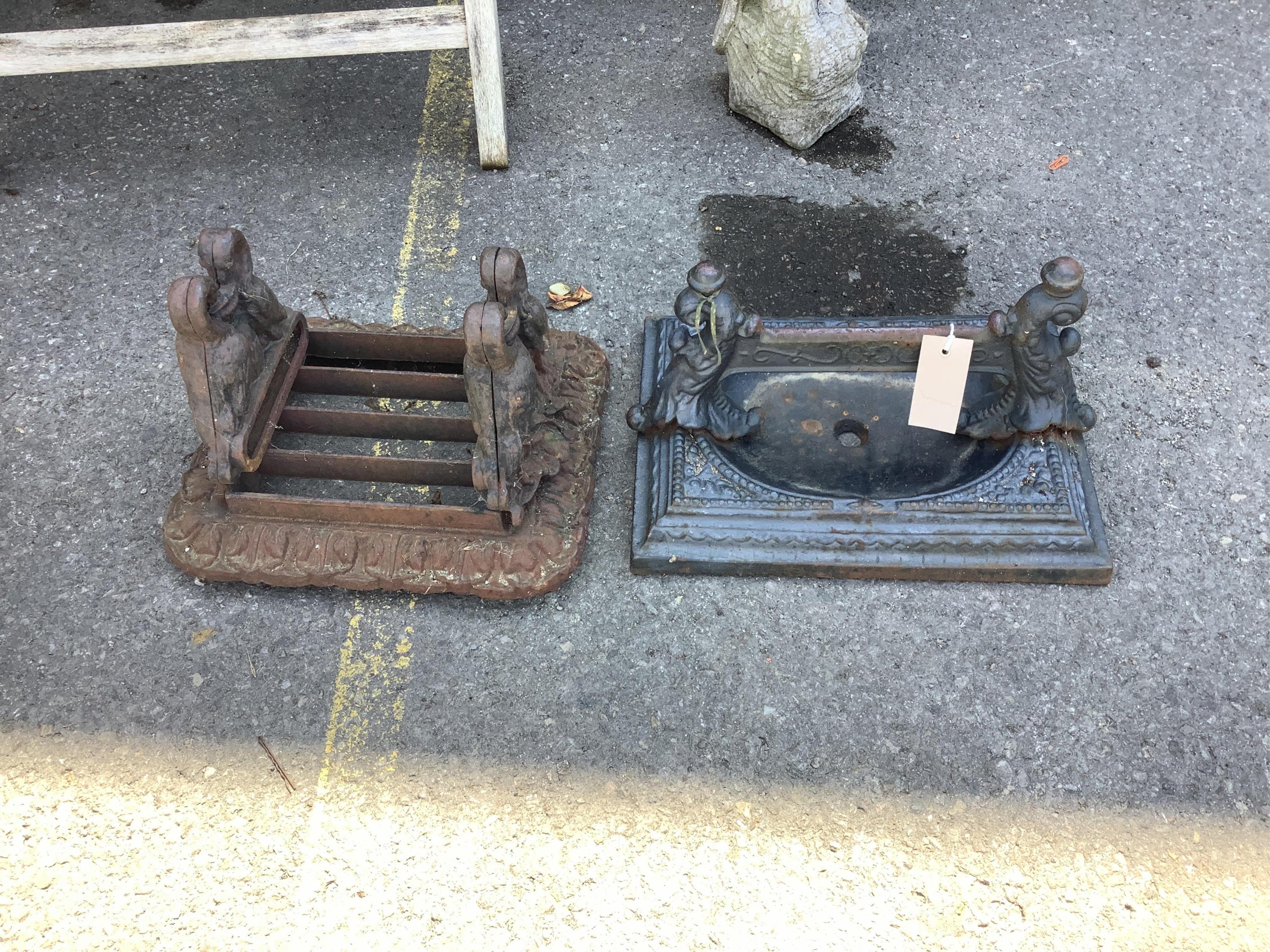 Two Victorian cast iron boot-scrapers, larger width 35cm, depth 25cm, height 20cm. Condition - poor